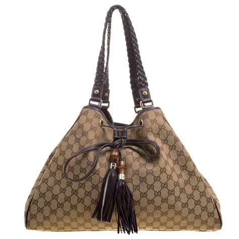 gucci small bag with braided button and tassel|Gucci .